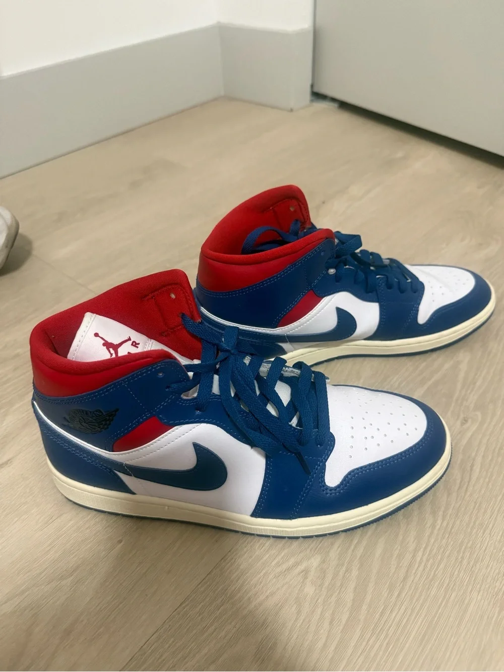 Jordan 1 Mid 'Patriots' sneakers in blue, white, and red